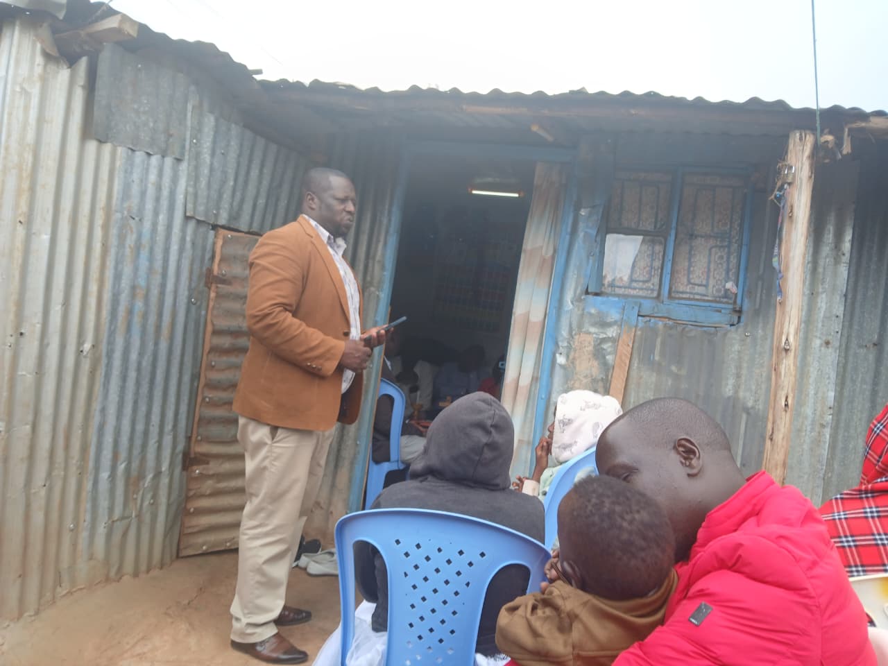 Listening first — Isoo meeting residents at their doorstep in Kimumu Ward.